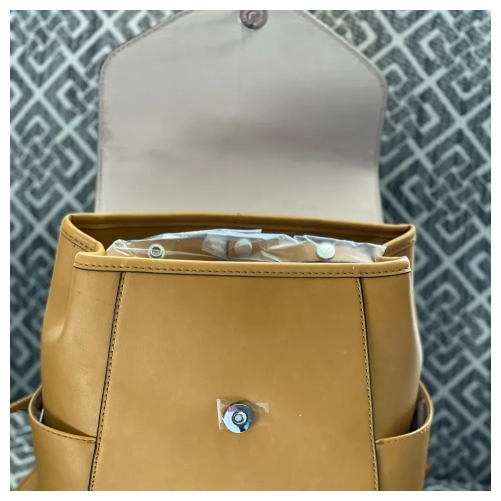 Nine West Jordyn Women's Flap Backpack in Butter with Magnetic Closure, Adjustable Strap, Side Pockets and Silver-Tone Hardware - Image 3